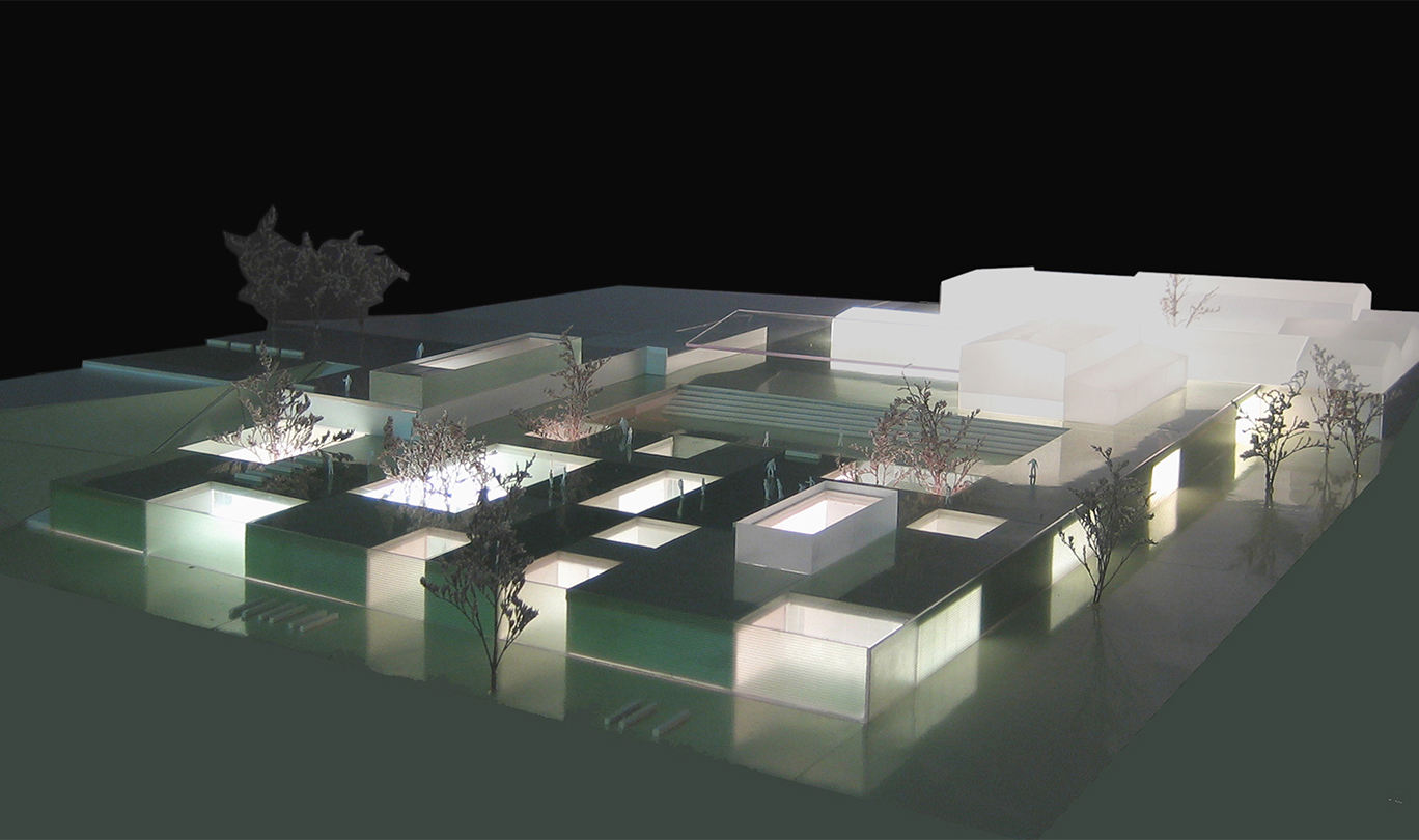 Modello di un edificio illuminato, con luci che evidenziano la sua architettura e design